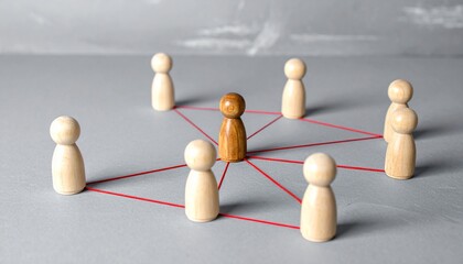 Obraz premium Central figurine connected by red strings.