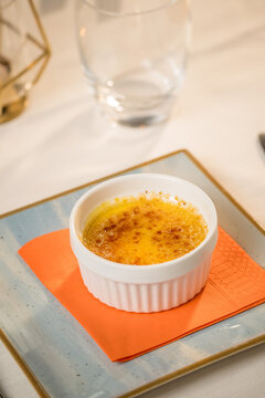 Elegant presentation of a classic Italian dessert served in a fine dining setting. The image captures the rich textures, delicate plating, and appetizing details of an artisanal sweet treat