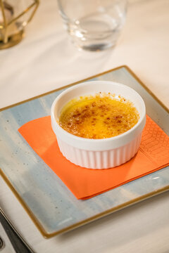 Elegant presentation of a classic Italian dessert served in a fine dining setting. The image captures the rich textures, delicate plating, and appetizing details of an artisanal sweet treat