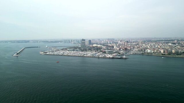 Atakoy Marina and Bakirkoy ferry with Istanbul city in the background circle