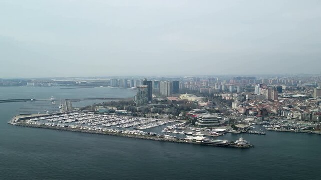 Atakoy Marina and Bakirkoy ferry with Istanbul city in the background zoom-out