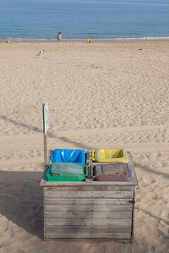 Four dumpsters wooden covered at beach