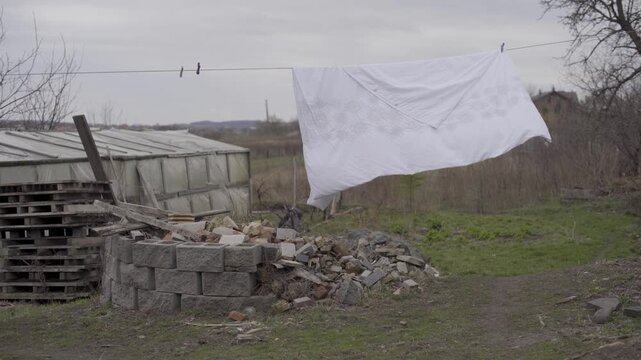 Embroidered Cloth Fluttering in the Wind: Rural Ukraine, March 2022