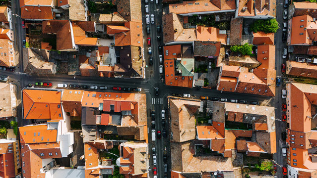 Aerial view of the historic Zemun district featuring traditional orange tiled rooftops and cars parked along narrow urban streets in Belgrade, City of Belgrade, Serbia.