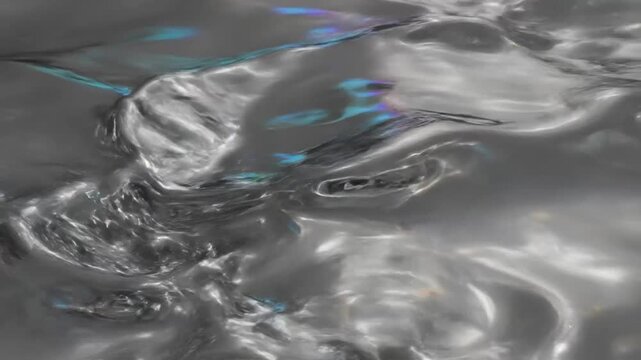 Abstract liquid metal animation with dynamic light reflections and shifting organic movement, creating a futuristic visual