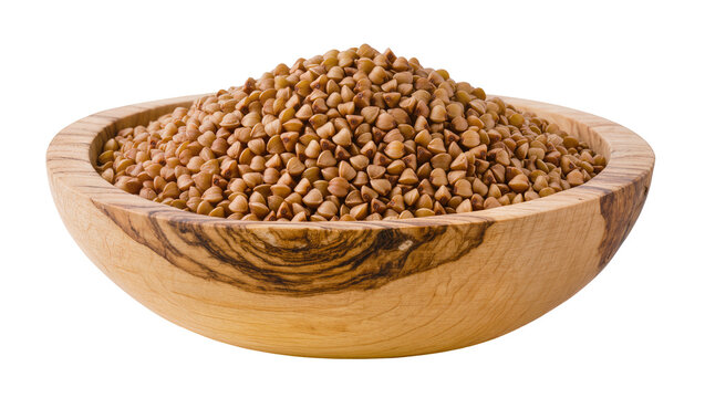 Wooden bowl filled with raw buckwheat groats