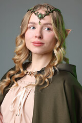 Naklejka premium Portrait of beautiful elf girl on grey background
