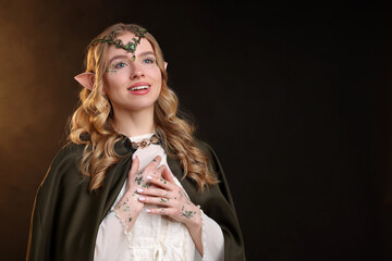 Naklejka premium Beautiful elf girl on black background with smoke, space for text