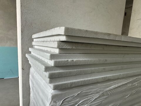 Expanded polystyrene cement sandwich panels indoors, closeup. Renovation material