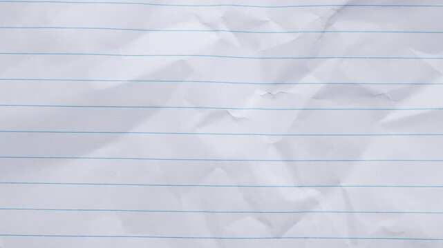 Blank crumpled lined notebook paper texture background stop motion