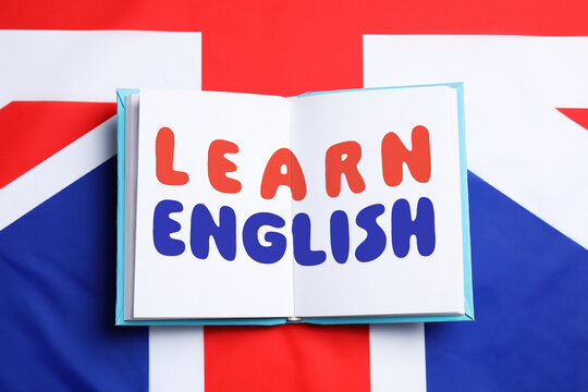 Learn English. Language course poster with book on flag of United Kingdom
