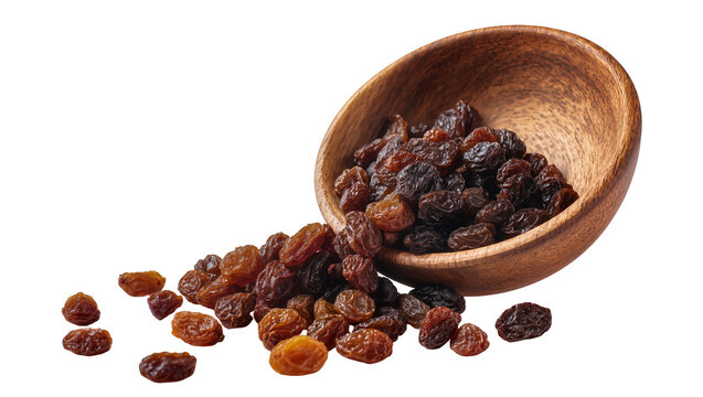 Wooden bowl full of dark brown wrinkled raisins scattered around