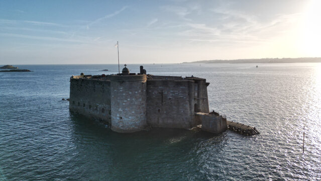 Aerial view of the imposing Chateau du Taureau fortress rises from the sea, a stony sentinel against the horizon, Plouezoc'h, Bretagne, France.