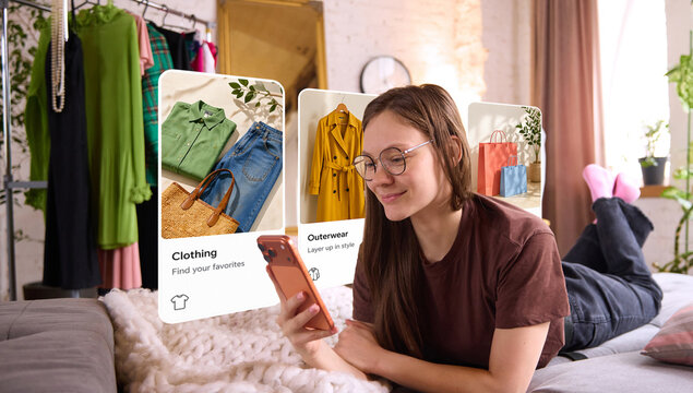 Woman relaxing on couch and browsing outfit options on smartphone with floating fashion interface. Concept of online shopping convenience, ecommerce lifestyle, home retail and digital outfit discovery