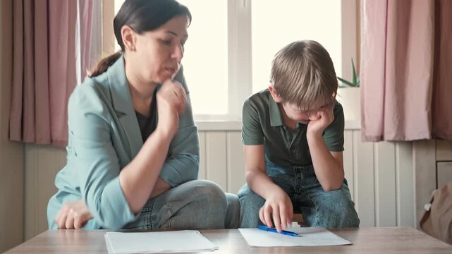Mom education son writing. Kids learn and study in home school. Mommy female helping teaching little boy support studying, learning homework. Child care teach study. Knowledge day. Children schooling.