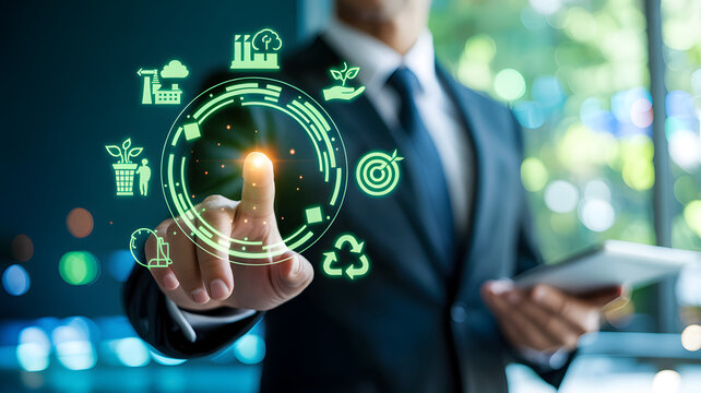 Businessman touching glowing digital circle with environmental icons during sustainable business meeting