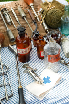 Antique medical bottles and instruments from World War I era