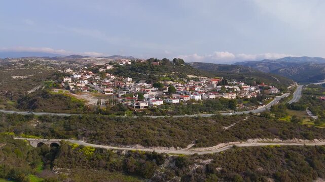 Aerial Drone Orbit Over Tiled Rooftops of Alassa Village in Limassol Cyprus