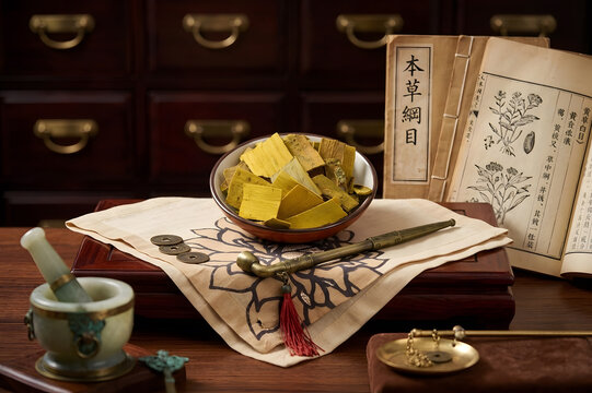 High-quality Phellodendron Bark (Huang Bai) slices with ancient medical texts, jade mortar and traditional oriental decor (generative AI background)