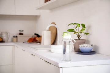 Fototapeta premium Sports water bottle on counter in kitchen
