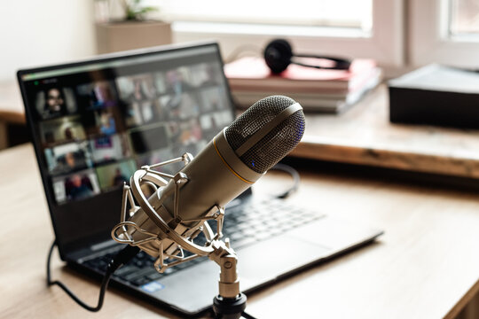 Home studio for podcast recording. Interior with microphone and laptop on table