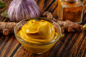 Naklejka premium Indian yellow spicy curry sauce