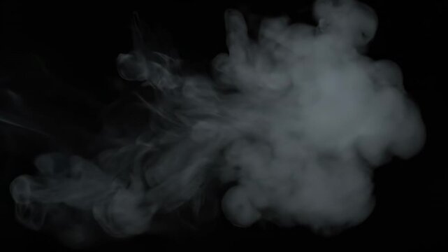 Wispy gray smoke cloud floating against a stark, black background