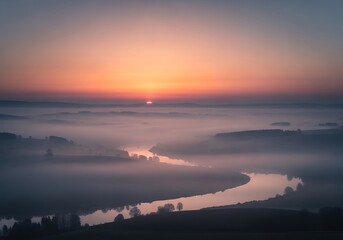 Fototapeta premium Serene Sunrise Over Misty River Landscape with Vibrant Sky.