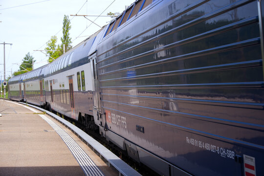 SBB CFF FFS passenger train at railway station of Swiss village of Glattfelden on a sunny late summer day. Photo taken September 7th, 2025, Zurich Glattfelden, Switzerland.