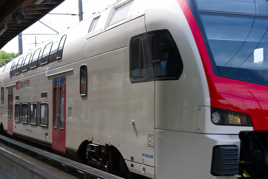 SBB CFF FFS passenger train at railway station of Swiss village of Glattfelden on a sunny late summer day. Photo taken September 7th, 2025, Zurich Glattfelden, Switzerland.