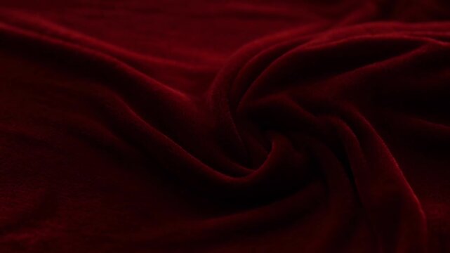 Deep Red Velvet Fabric With Smooth Waves And Soft Lighting Creating Elegant Texture And Luxurious Feel