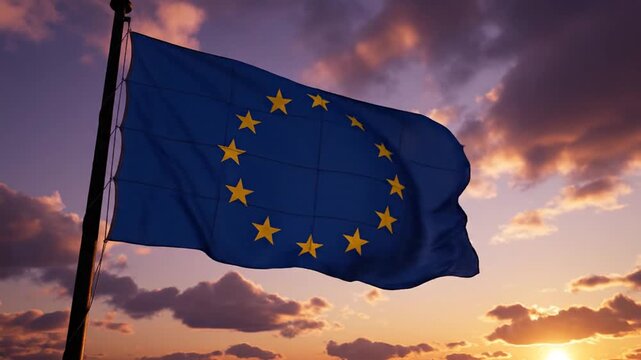 European Union flag waving on flagpole against a dramatic sunset sky with golden clouds