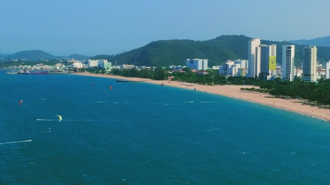Aerial 4K parasailing adventure over turquoise ocean in Nha Trang Vietnam
the thrill of extreme water sports, the vibrant colors of the parachute, and the white wake of the boat against the blue sea