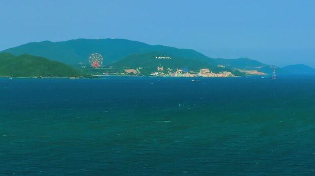 Aerial 4K parasailing adventure over turquoise ocean in Nha Trang Vietnam
the thrill of extreme water sports, the vibrant colors of the parachute, and the white wake of the boat against the blue sea