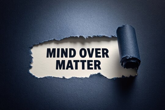 Mind Over Matter motivational quote revealed beneath torn blue paper