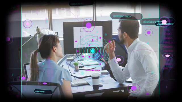 Two designers pointing, leaning at screen while peer passing frame shifting AR focus to review plan