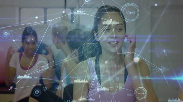 Camera shifting center woman in pink tank fitness gesturing sharing tips while HUD nodes animating