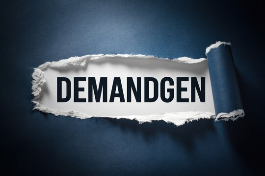 Demandgen marketing term revealed in a tear of dark blue paper