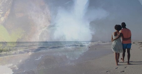 Fototapeta premium Walking couple hugging along beach, footprints on wet sand, sundress, swim shorts, wash, copy space