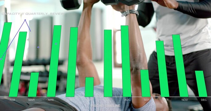 Pressing lifter holding dumbbells on flat bench in gym, gray shirt, spotter watch, FEB-DEC overlay