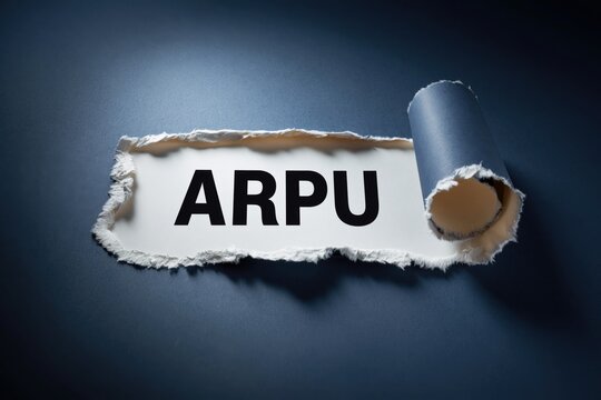 ARPU acronym for Average Revenue Per User revealed in torn paper