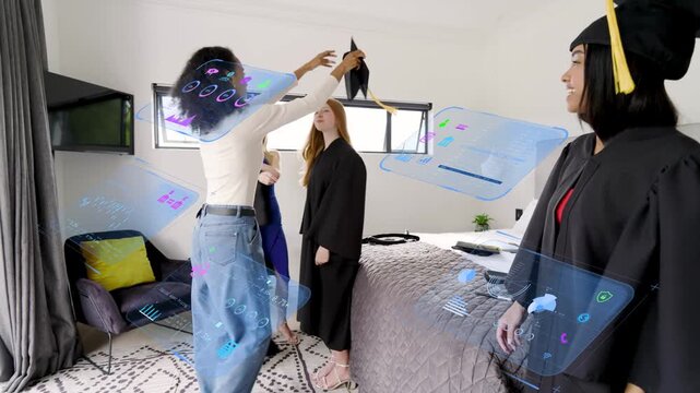 Four women dressing in room helper handing cap fitting gown for graduation with hologram overlaying