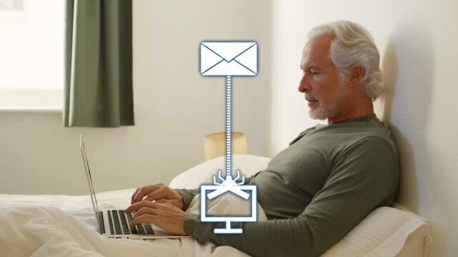 Senior man typing in bed, envelope sending malware to laptop, security shield blocking threat