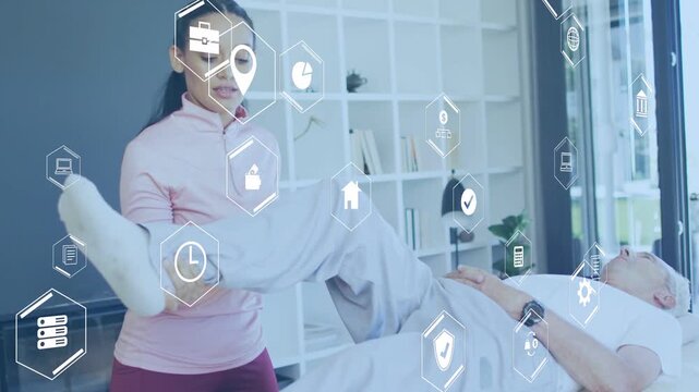 Female PT approaching patient, guiding bent leg on table for therapy, hex icons overlaying scene