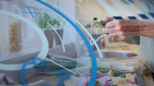 Mature cook reaching herb, trimming with snips and garnishing veg while blue overlay tracking hands