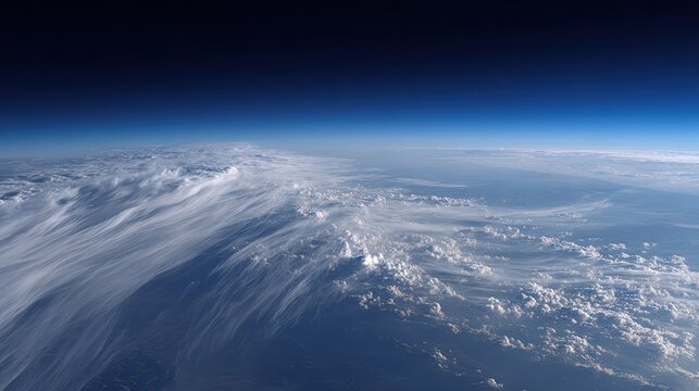 Globe showing layers of atmosphere and diverse cloud patterns, including cirrus clouds contrasting with cumulus clouds, creating a panoramic view from above