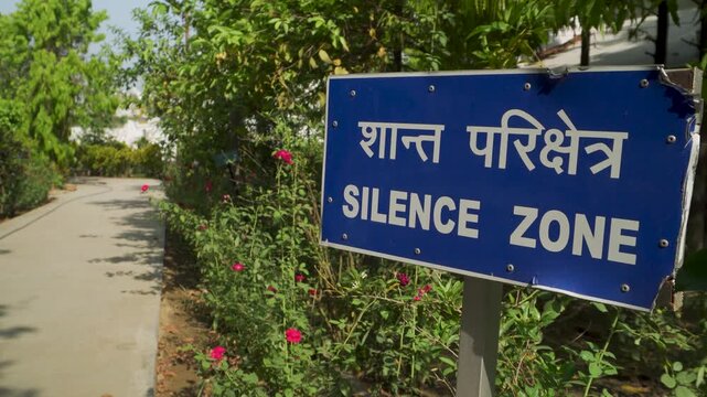 Silence zone sign in garden walkway