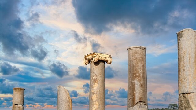 A row of ancient Ionic columns lining the colonnaded street at Patara archaeological site, Antalya, Turkey