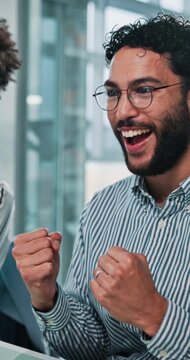 Celebration, success and man in office for web design, business ideas or software developer. Approval, fist pump and designer with teamwork, research report or solution at creative digital agency