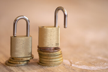 Brass Padlocks on Euro Coins Stack for Financial Security Concept © sal
